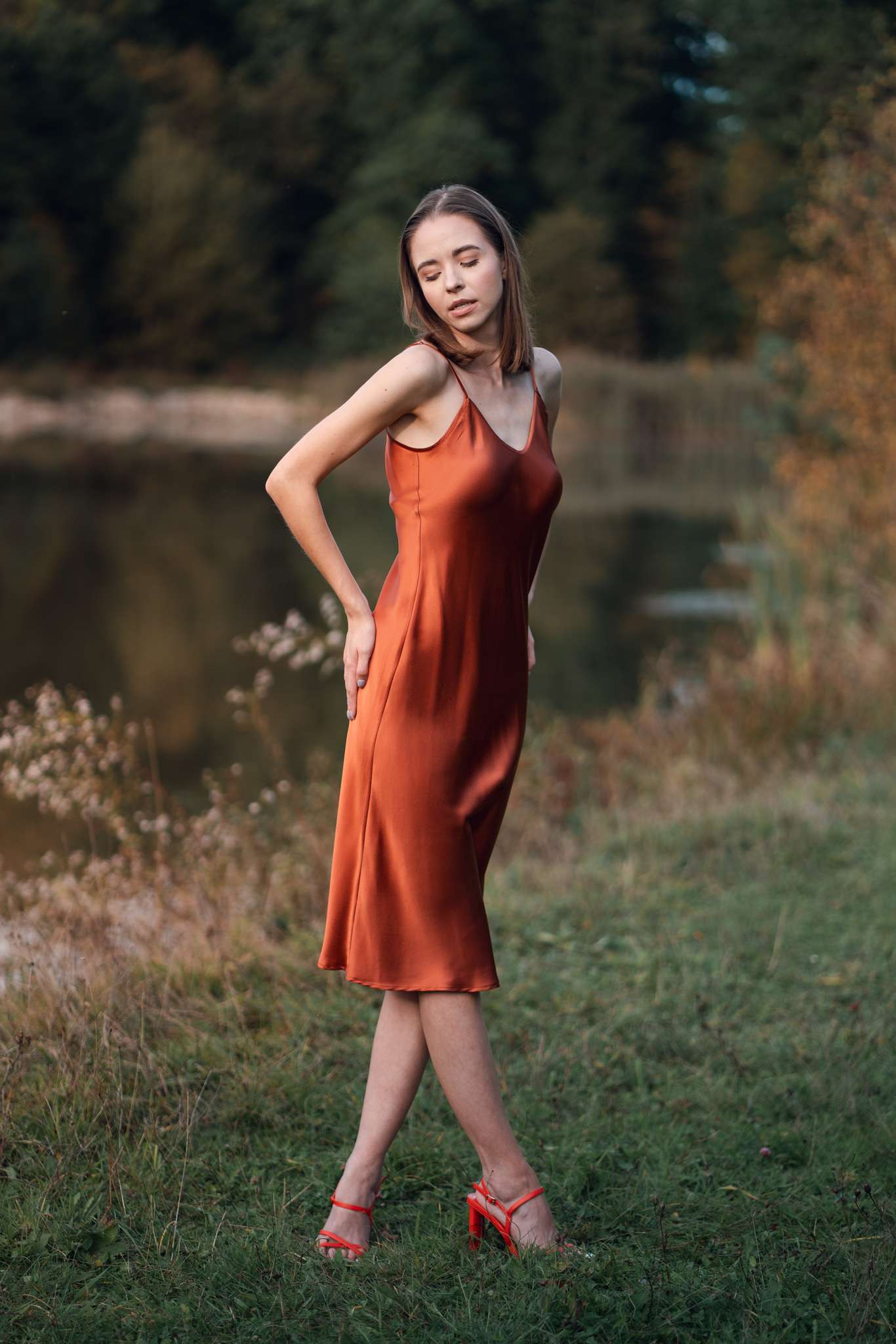 Woman wearing orange silk Closet classic dress